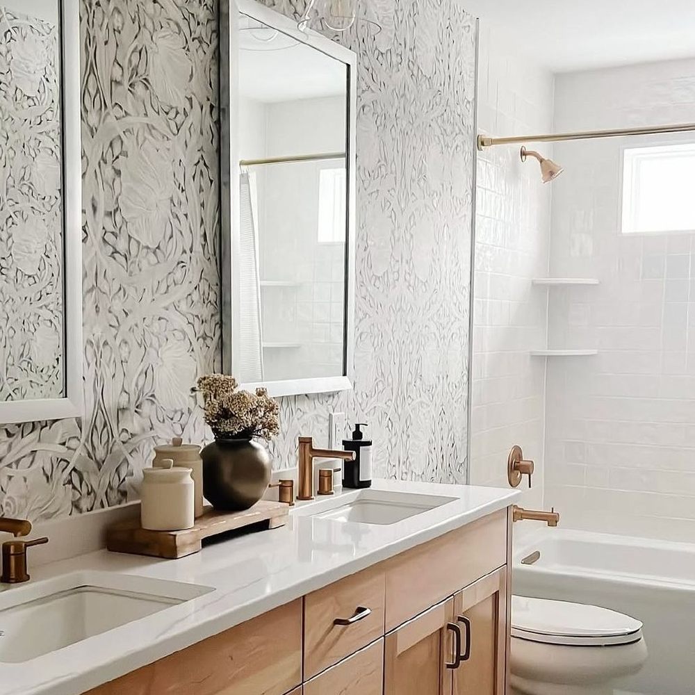 Patterned wallcovering installed in a refined bathroom